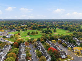 Aerial View Front- Interior Townhouse/2 Levels Brick and Vinyl Sided Exterior Pop-up Attic 1 Car Attached Garage Additional Assigned Parking