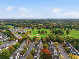 Aerial View Front- Interior Townhouse/2 Levels Brick and Vinyl Sided Exterior Pop-up Attic 1 Car Attached Garage Additional Assigned Parking