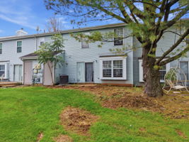 Rear View- interior Townhouse/2 Levels Brick and Vinyl Sided Exterior Pop-up Attic 1 Car Attached Garage Additional Assigned Parking