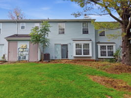 Rear View- Washing Machine - 2026 Freshly Painted 1st Level - 2025 LVP Flooring 1st and 2nd Level - 2025 Newer Faucet in Kitchen and Primary Bath Primary Bath Updated Ceramic Tile Shower and Floor HWH - 2023 AC - 2023 Gas Range - 2023