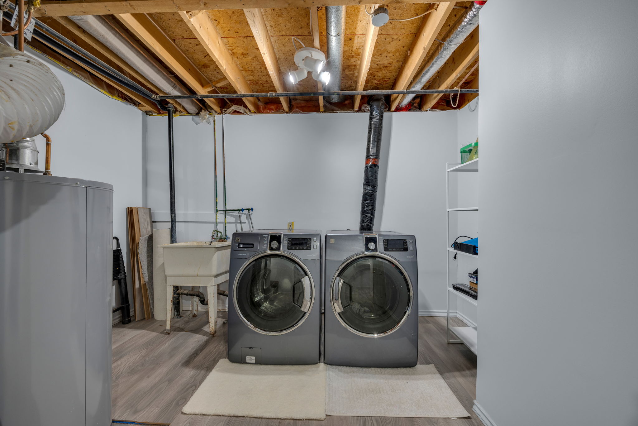 Mechanical/Laundry room with finished floors