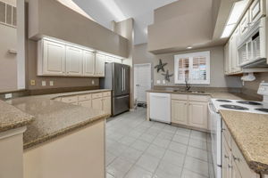 Kitchen has granite countertops and open to Great Room