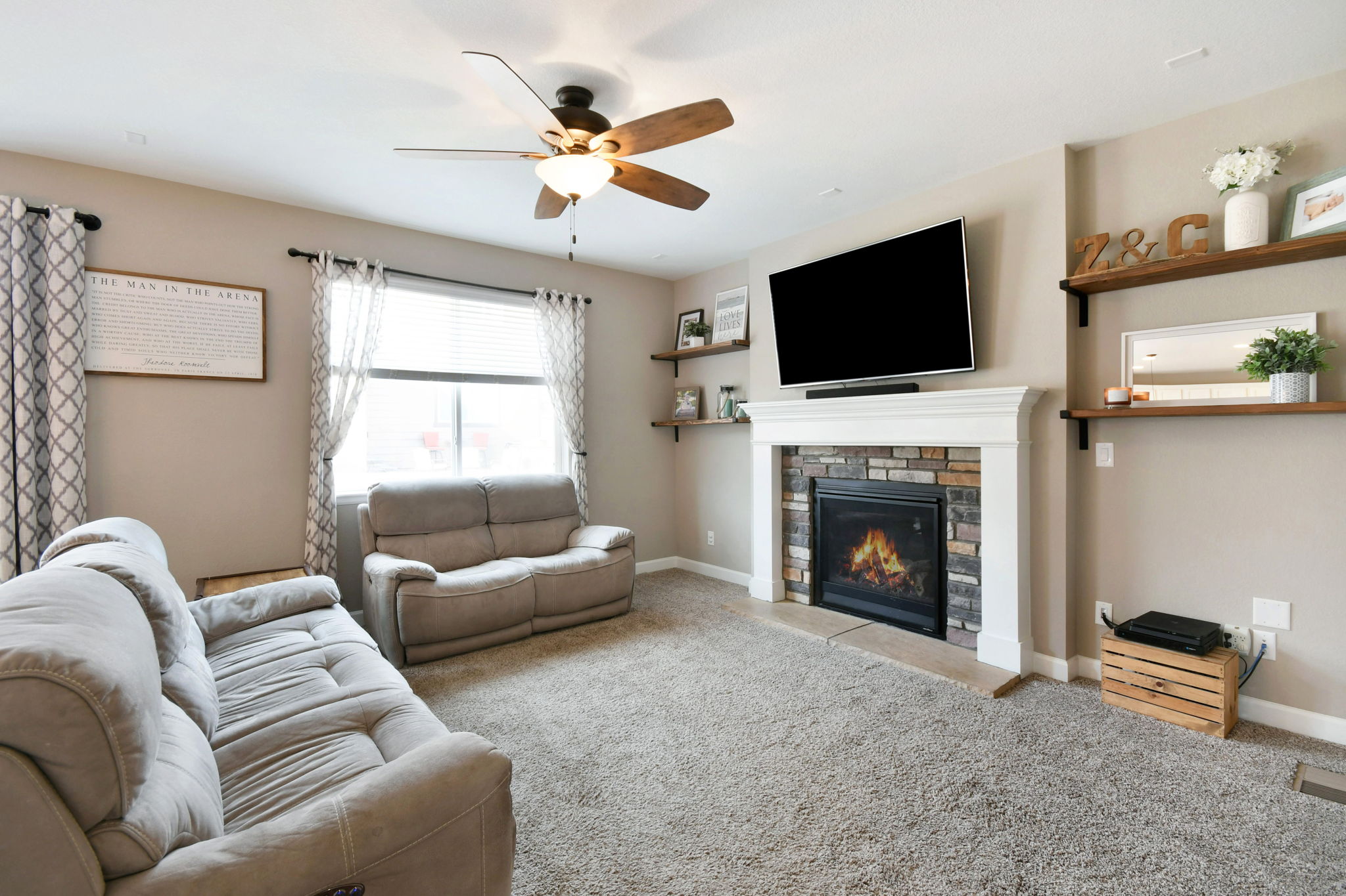 Great Room with custom shelving and gas fireplace