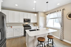 Bright white Kitchen with slate appliances