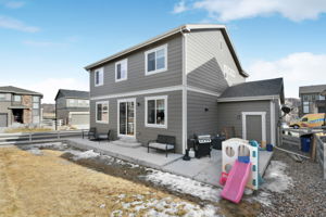 Extended back porch with garage service door