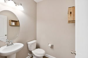 Powder bath on main level with wood floors