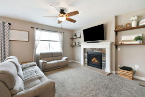 Great Room with custom shelving and gas fireplace