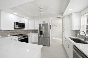 Kitchen renovated with Quartz countertops, subway tile backsplash, stainless steel appliances