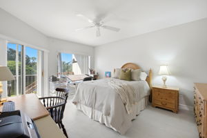 Large picturesque window with sliders leading to glassed-in lanai
