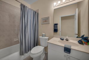 Guest Bathroom is located in hall convenient to both bedrooms