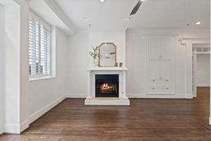 Cozy up to the gas fireplace and enjoy the architectural built-ins and natural light