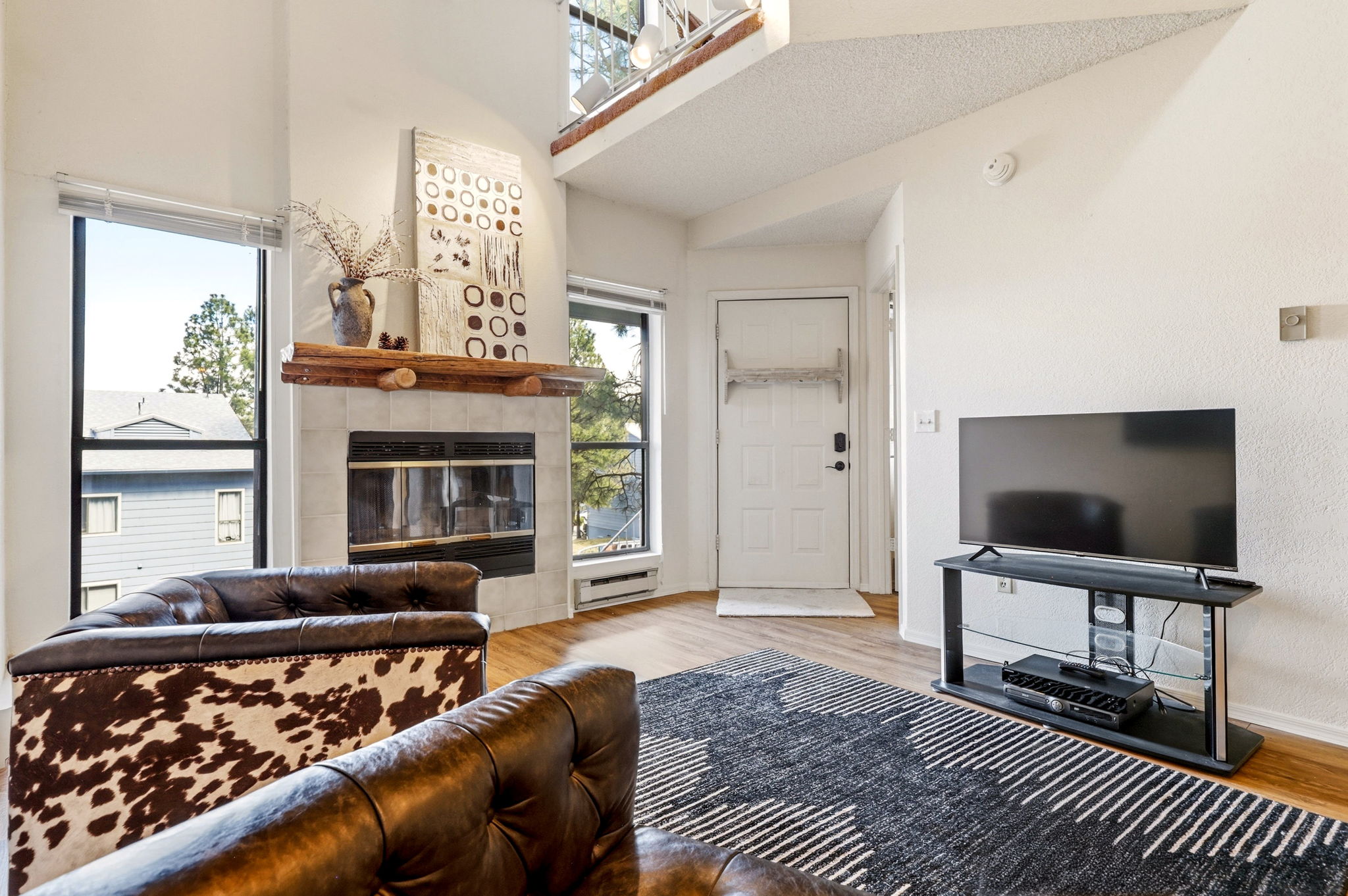 Expansive windows bring in natural light and  outdoor views.