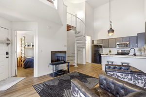 Spiral staircase leading to a spacious master loft retreat.