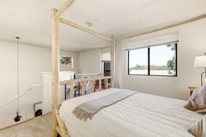 Vaulted ceilings in the loft create an open, airy retreat.