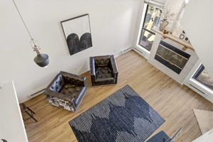 Overlook the living space from the elevated loft above.