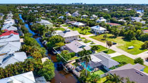 Aerial Rear Exterior 2 - lot line water enhancement in canal