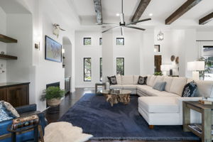 Living room with gallery hall leading to office and bedroom 2.