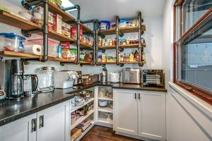 Awesome pantry behind custom barn dodor