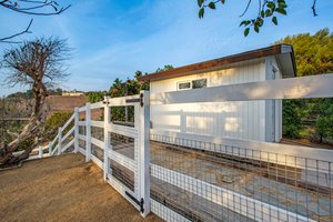 Fenced path to Barn - storage shed