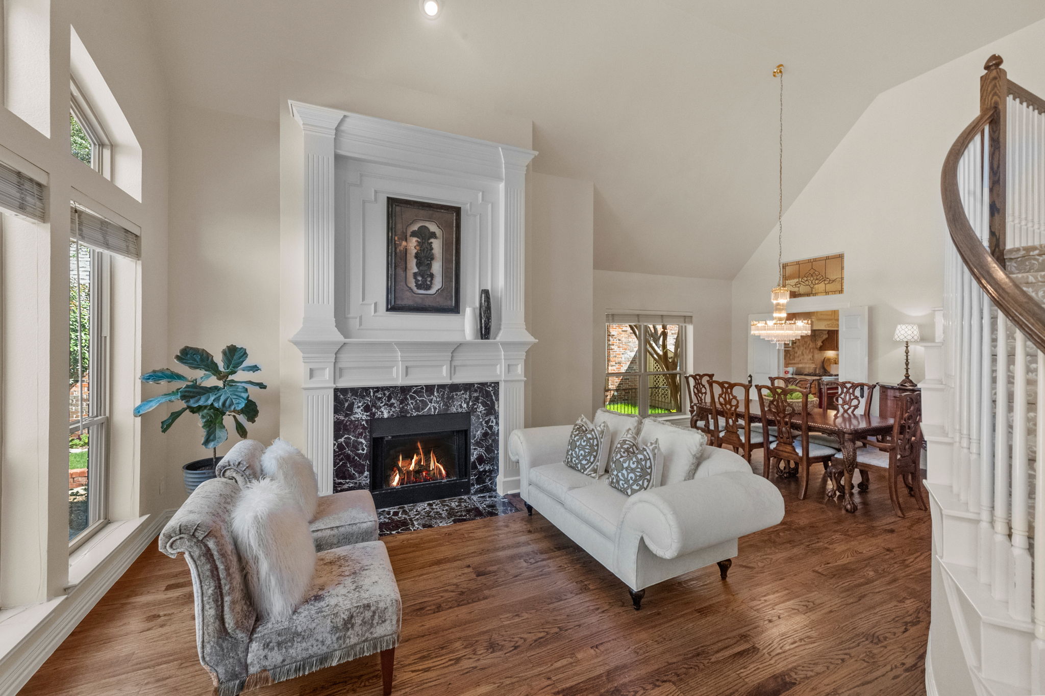 The formal living has a beautiful gas fireplace and is open to the formal dining.