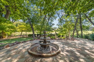 Imagine your friends and family gathered around your fountain.  It sets the mood to the backyard oasis, lush with shade trees and your own putting green.