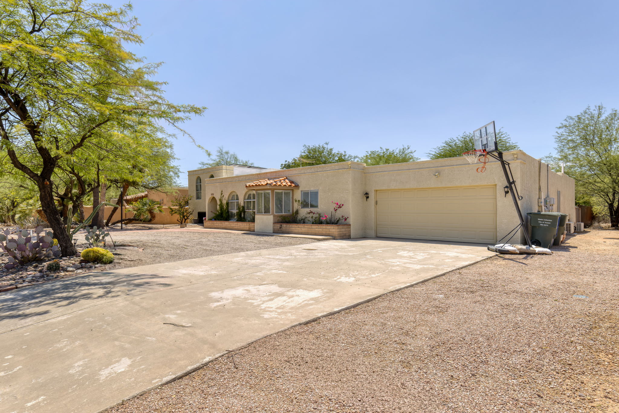 Concrete driveway to the two-car garage