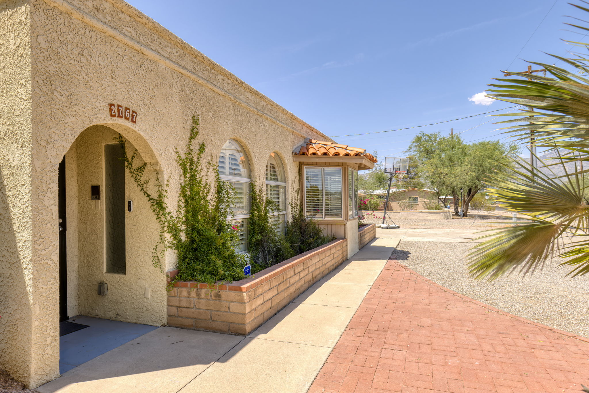 Covered front entry. Catalina Mountains to the North