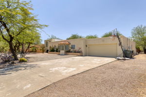 Concrete driveway to the two-car garage