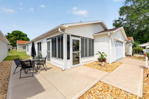 SPACIOUS Front and Side Patios with LOW-MAINTENANCE stone landscaping