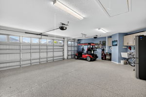 Expansive 2 Car + Golf Cart Garage