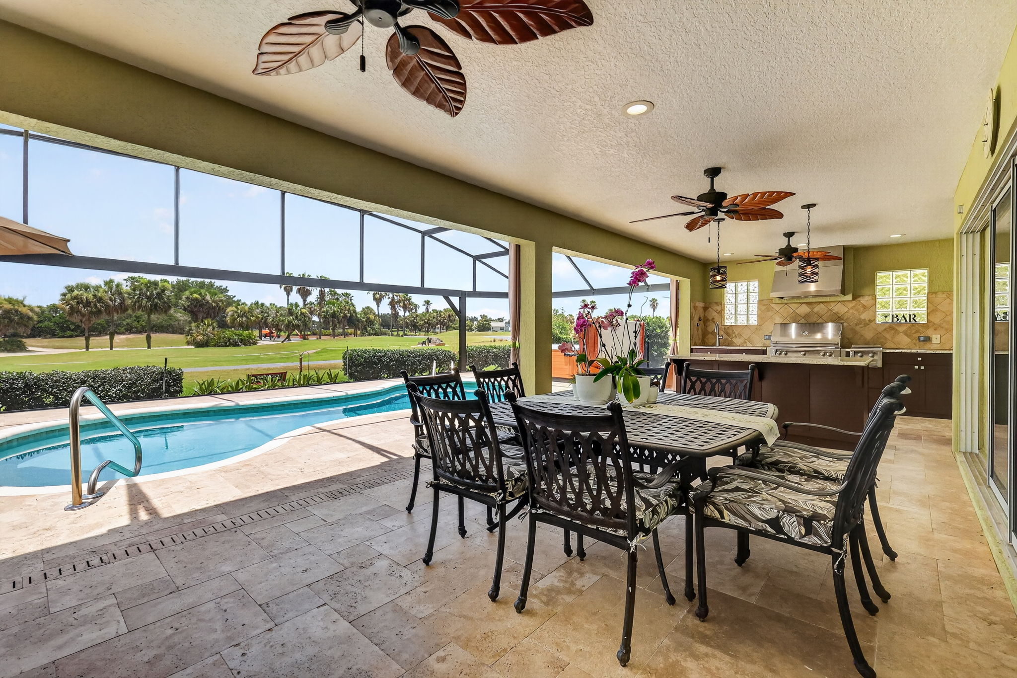 Swimming Pool, Hot Tub, Lanai, and Outdoor Kitchen with Golf Front Views