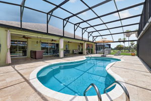 Swimming Pool, Lanai, and Outdoor Kitchen with Golf Front Views!