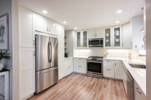 With stainless appliances, glass door cabinetry, and abundant storage this kitchen has a great balance of style and function!