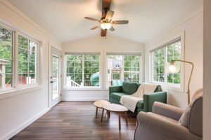 The sunroom provides an abundance of natural light and access to the backyard patio and play space.