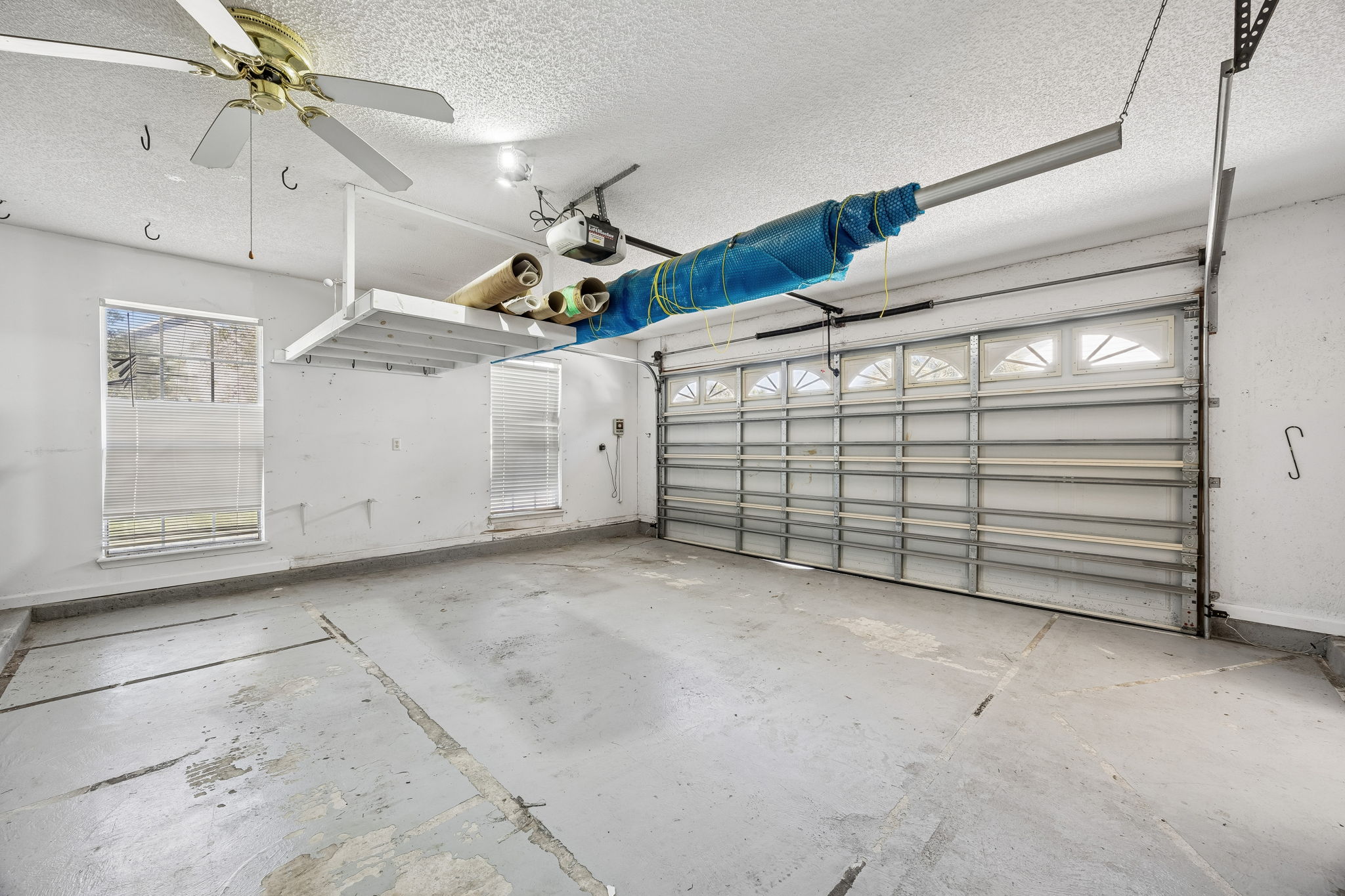 Side entry 2-car garage with storage space.