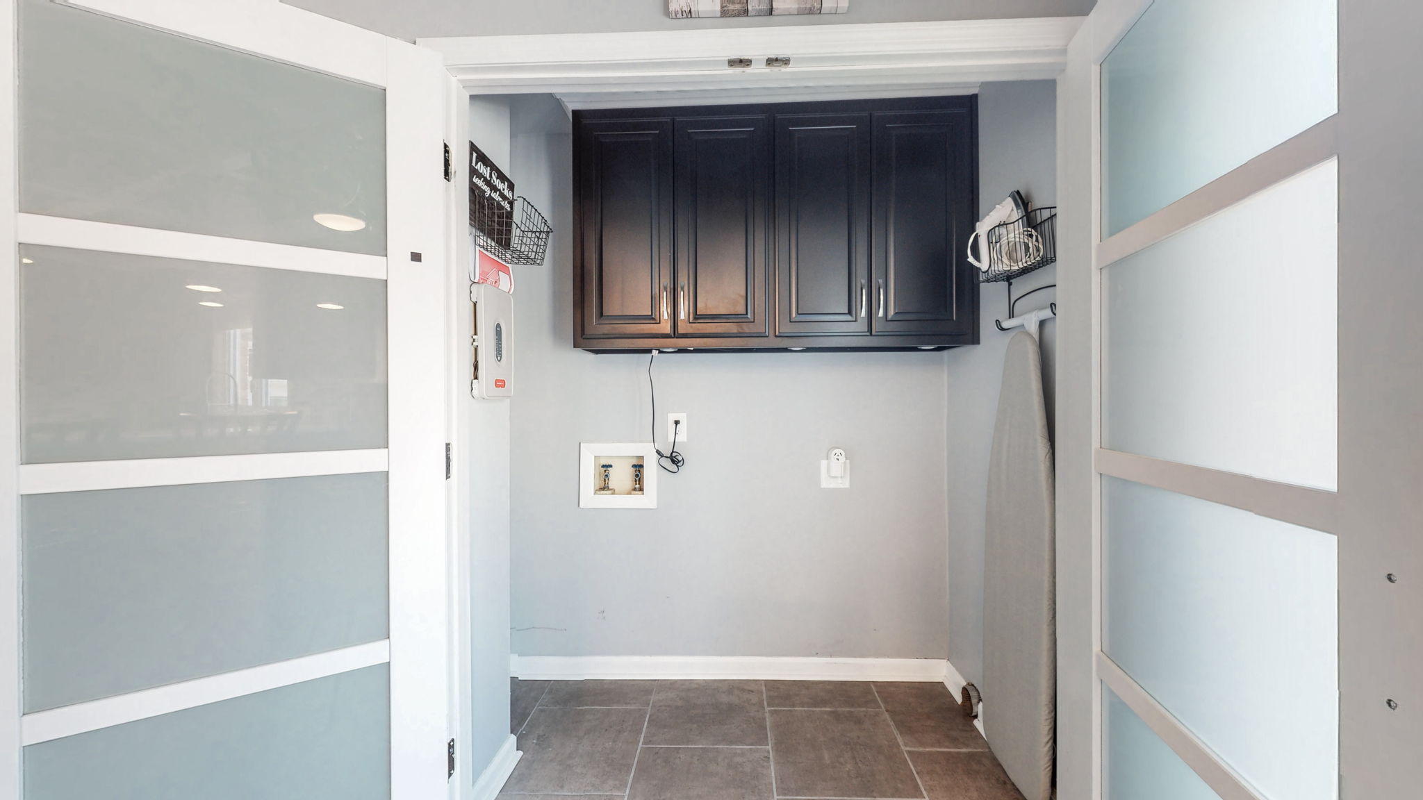 The laundry area conveniently located near the kitchen.