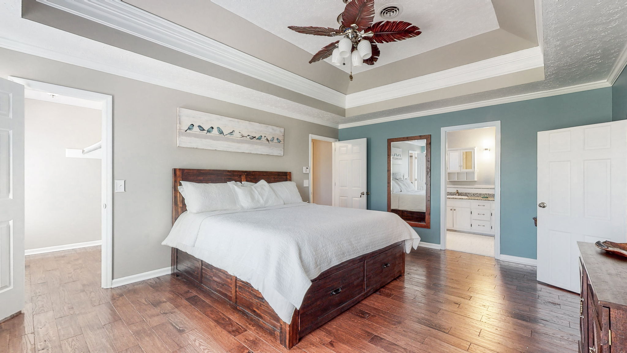 Two large walk-in closets and a master bath adjoin this charming master suite.