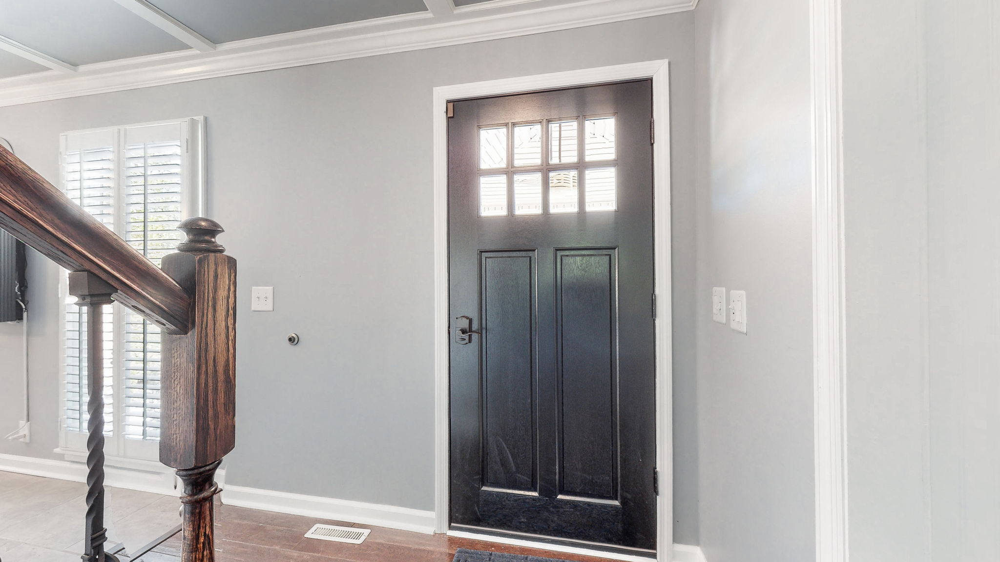 Even the front door invites the sunlight into this beautiful home.