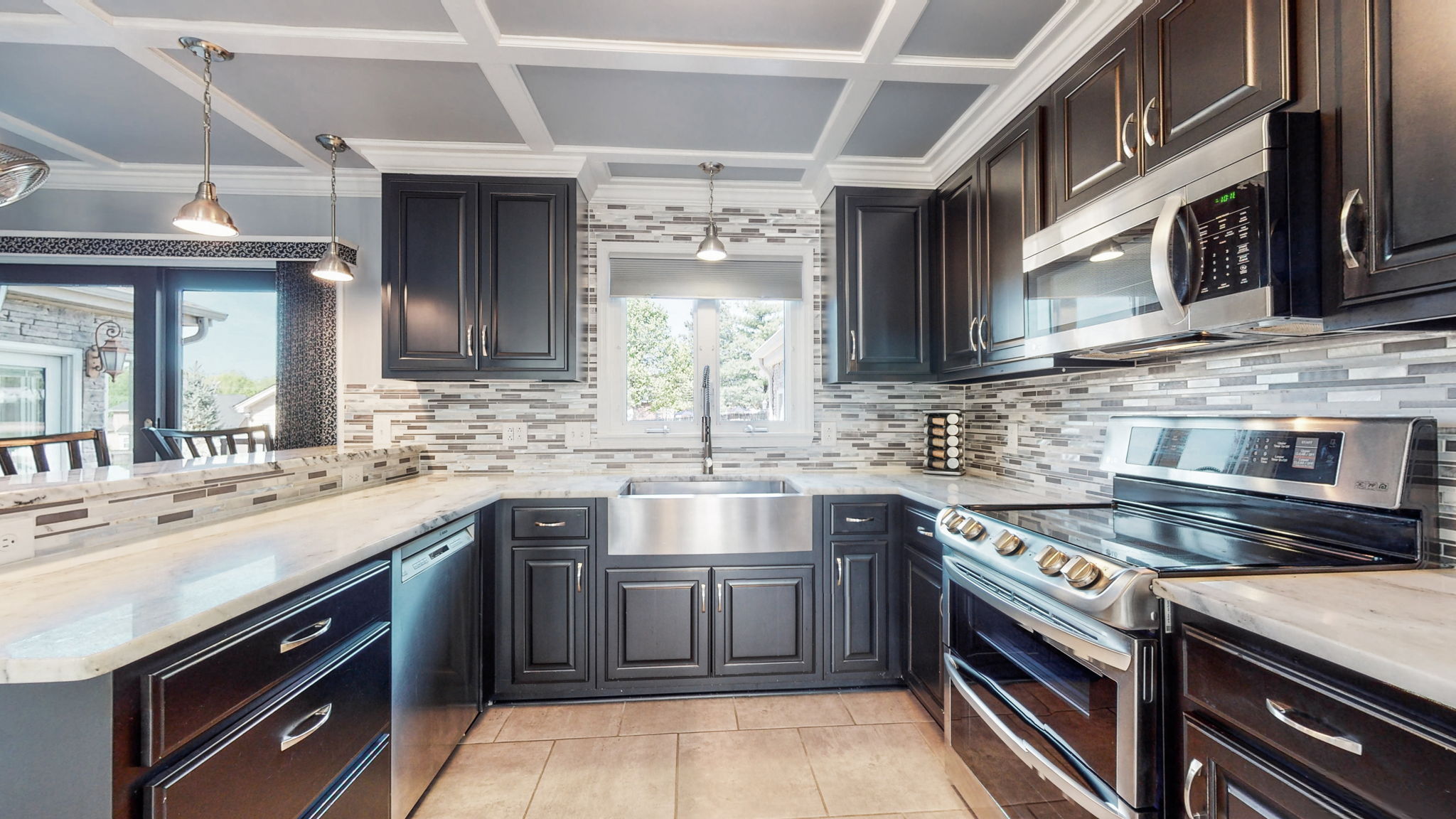 With beautiful views into the park-like backyard from the window over the sink, who would not enjoy cooking in this elegant kitchen.