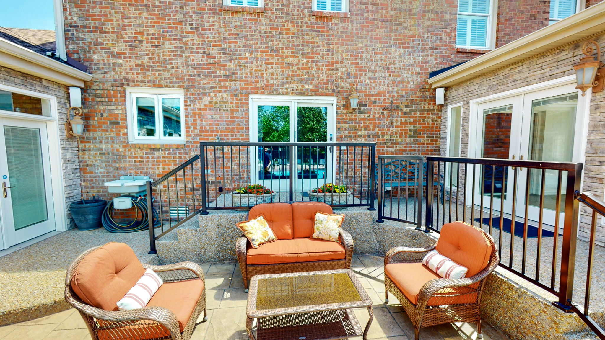 Stay close to the house and enjoy this seating area viewing the entire resort-like backyard.
