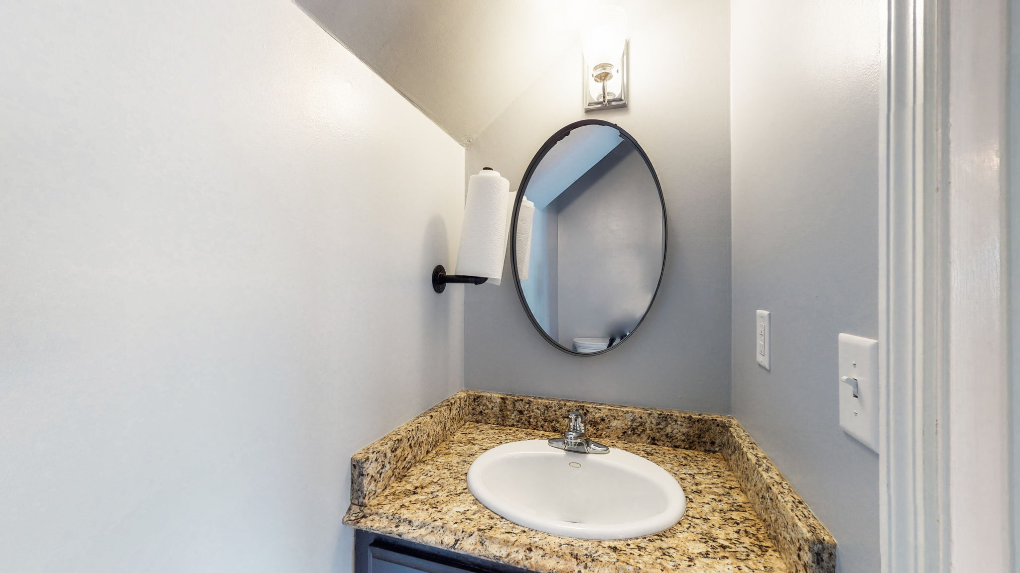 A half bath convenient to the game room and both sunrooms.