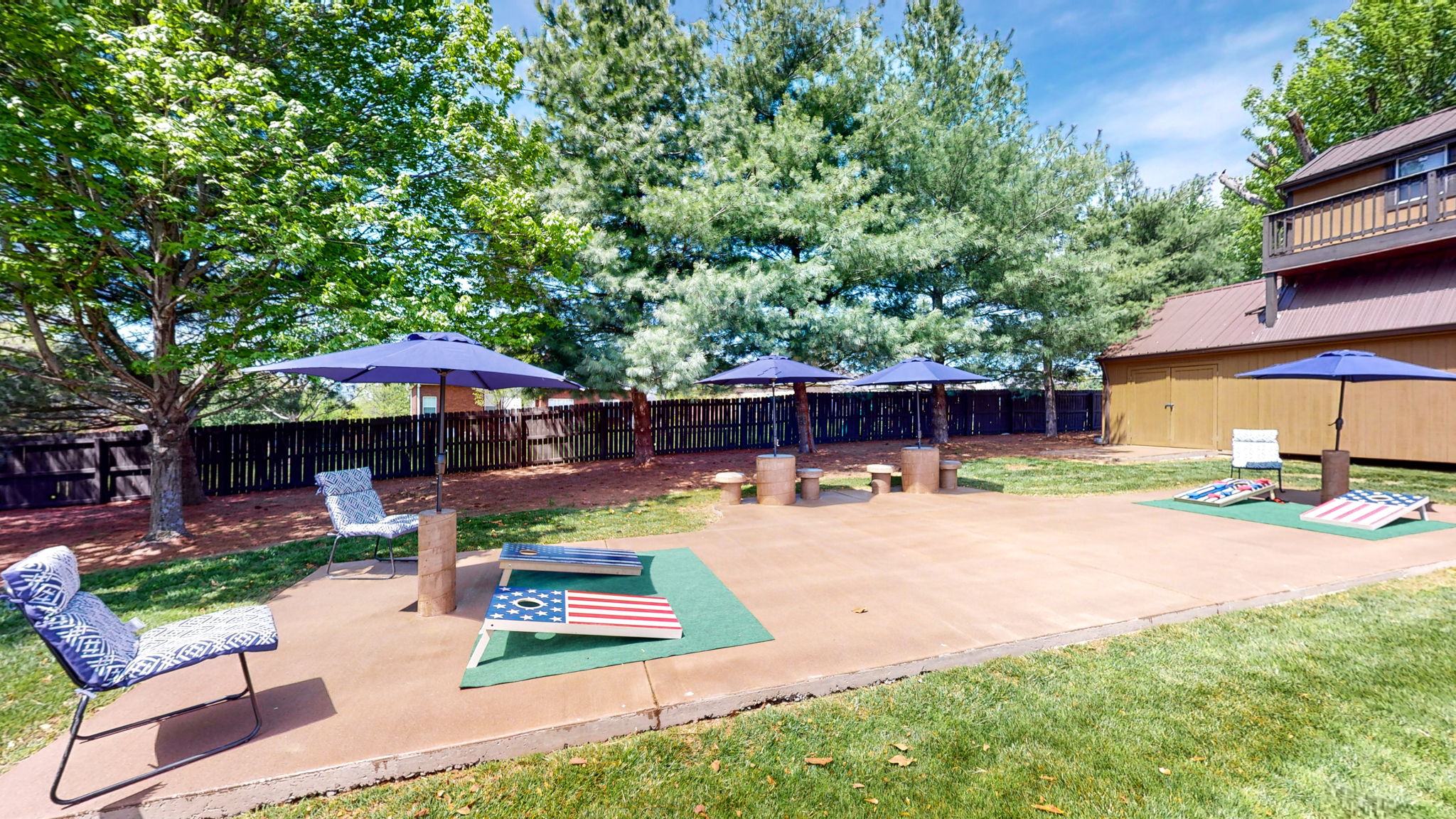 Another entertaining game to bring everyone together in competition is cornhole! So fun to watch, play and even more fun to win! Who would not want to play on this fun cornhole court with concrete umbrella stands, seats and tables.