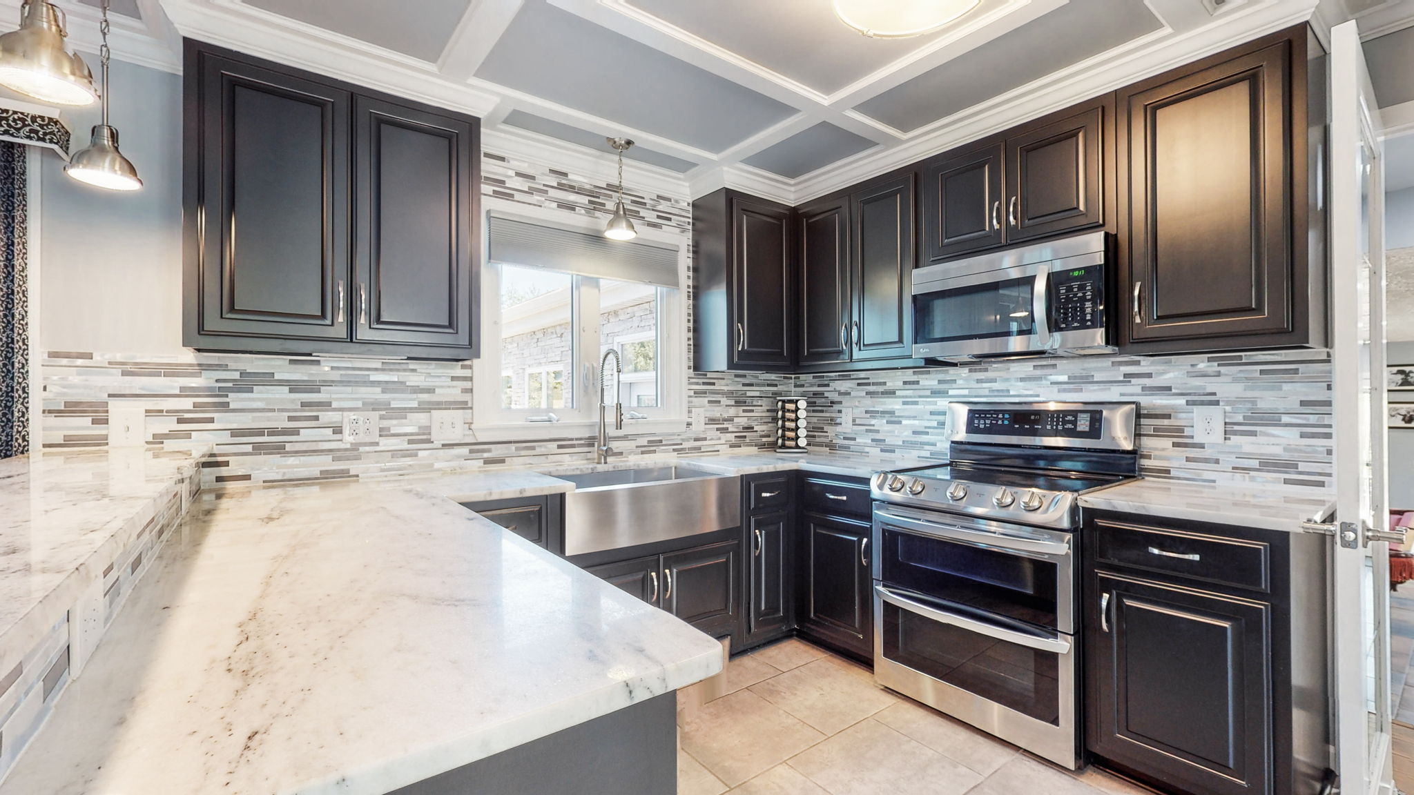 All stainless steel appliances, beautiful dark cabinets and amazing white marble countertops!!