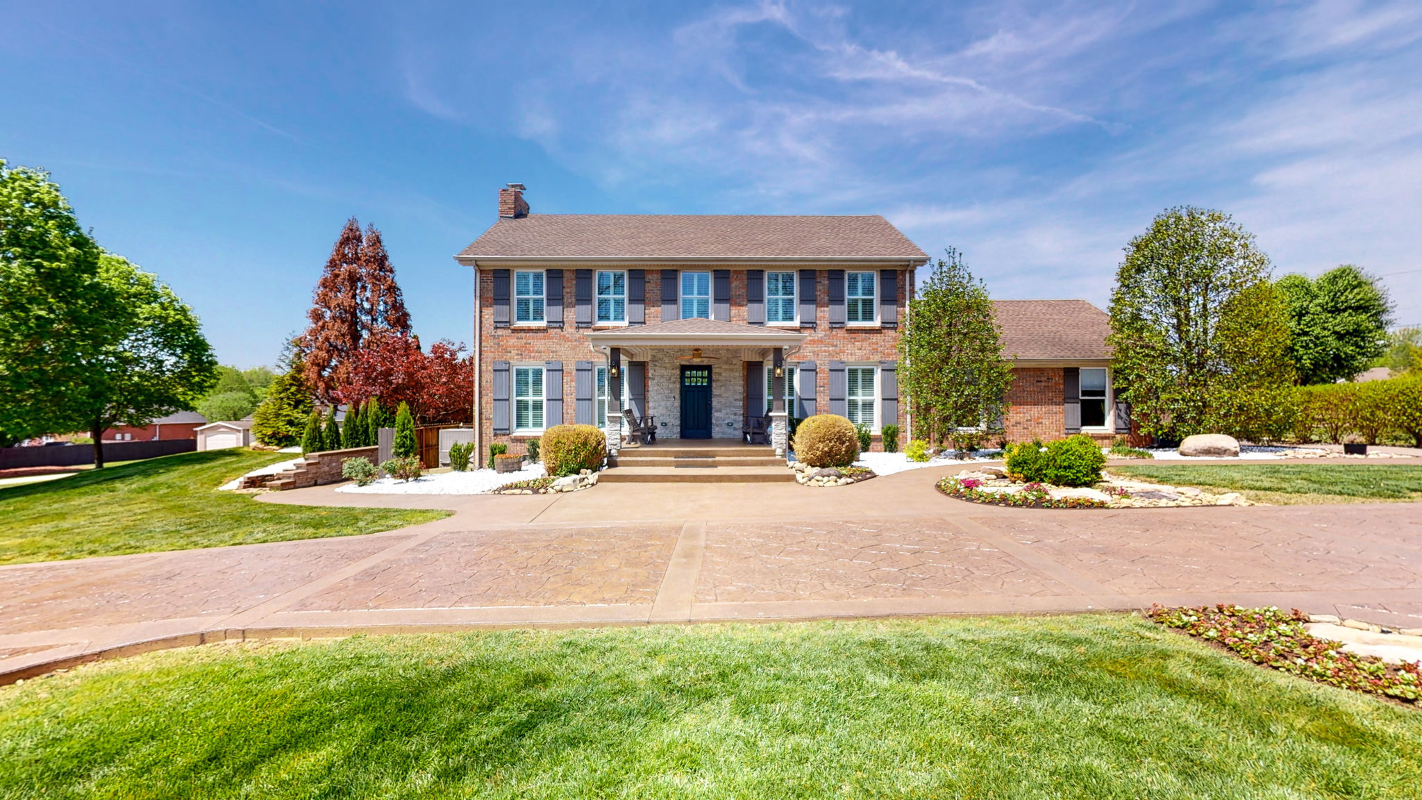 At this beautiful, inviting home, all gutters drain to leave the lot (underground).