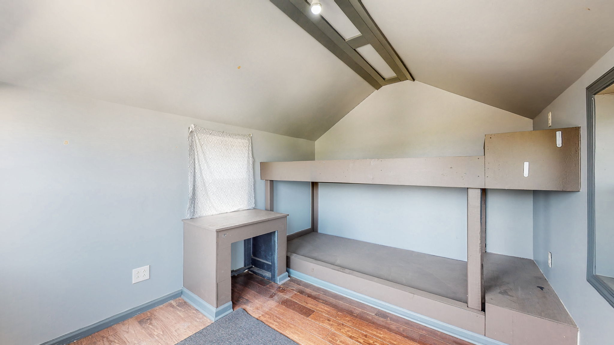 This extra-exciting treehouse shelters built-in bunk beds, and a desk, complete with electricity for heat and cool in the upstairs room.
