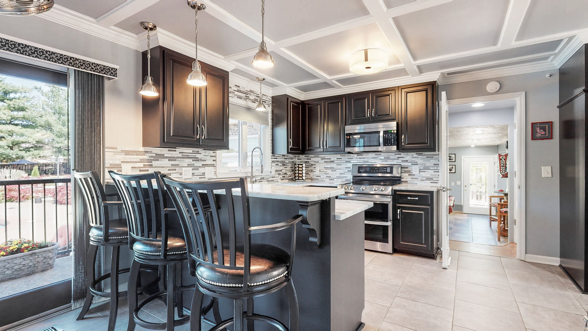 Awesome, spacious and up-to-date kitchen with tons of natural sunlight!  Beautiful views to the saltwater pool and amazing backyard!