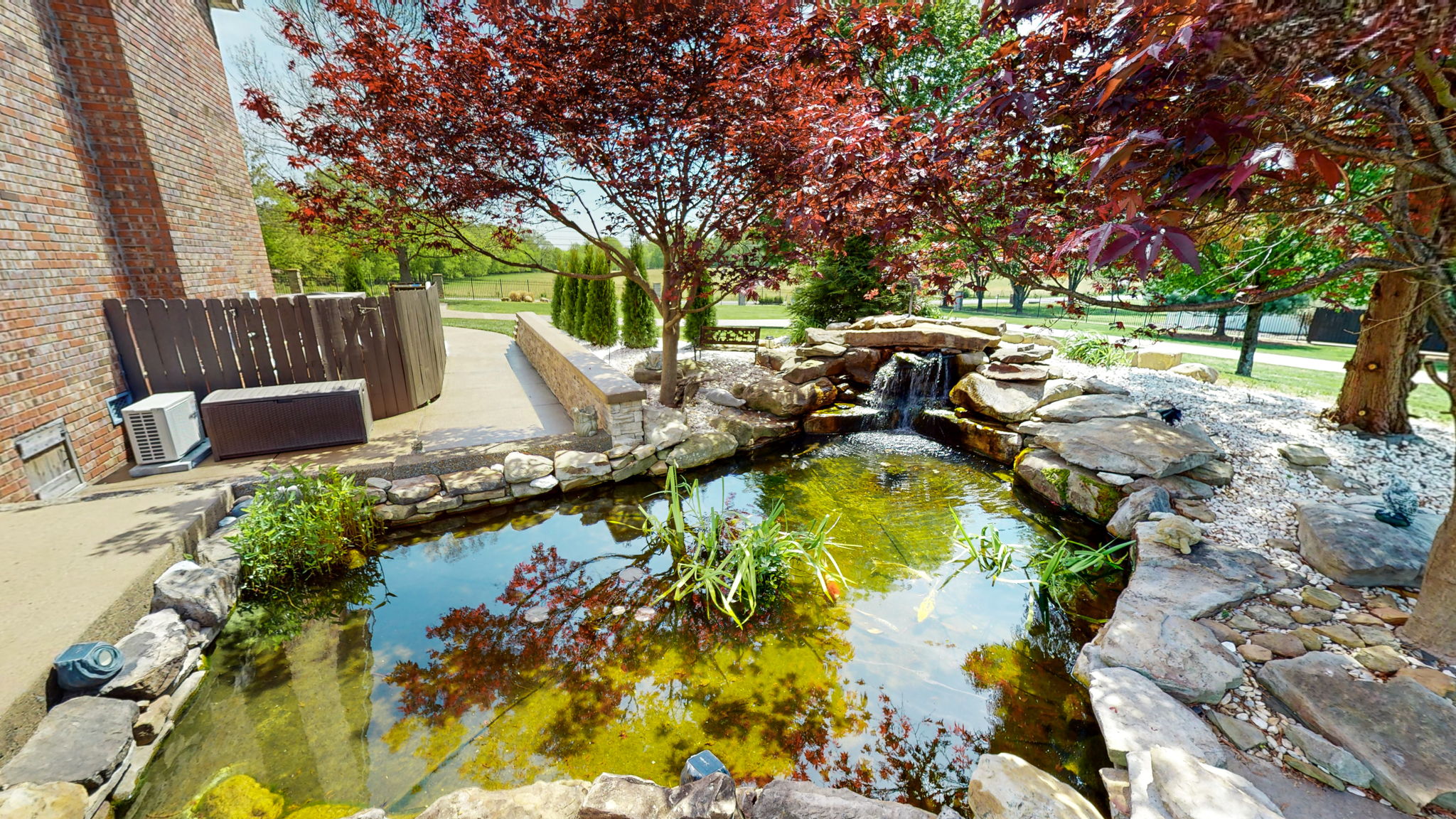 Your own beautiful, tranquil Koi pond, complete with waterfall. (Koi symbolize strength, courage, patience, and success through perseverance). Now, who doesn't need that?  Be sure to look for the alligator sculpture in the pond.