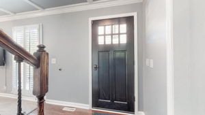 Even the front door invites the sunlight into this beautiful home.