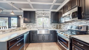 With beautiful views into the park-like backyard from the window over the sink, who would not enjoy cooking in this elegant kitchen.