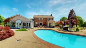 An inviting saltwater pool is only one of the engaging activities in the amazing backyard.